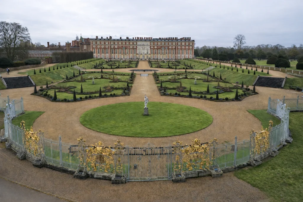 The formal Privy Garden at Hampton Court Palace with the ornamental screen along its edge